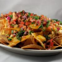 Regular Nachos · Choice of meat, tortilla chips, beans, melted Jack cheese and salsa. 