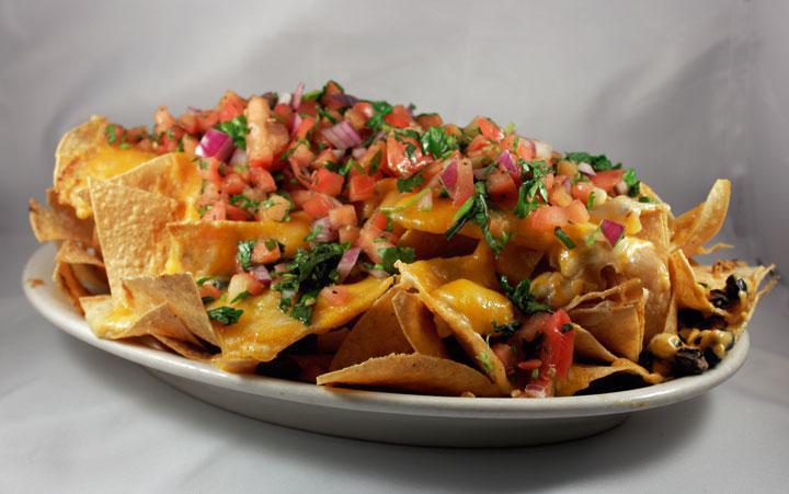 Regular Nachos · Choice of meat, tortilla chips, beans, melted Jack cheese and salsa. 