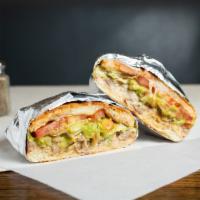 Torta De Milanesa · Toasted Mexican bread with refried beans, cheese, sour cream, tomato, lettuce and guacamole.

