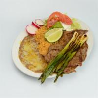 Steak Plate · Grilled steak with green onions, rice, beans, sour cream, guacamole, salsa and corn tortilla...