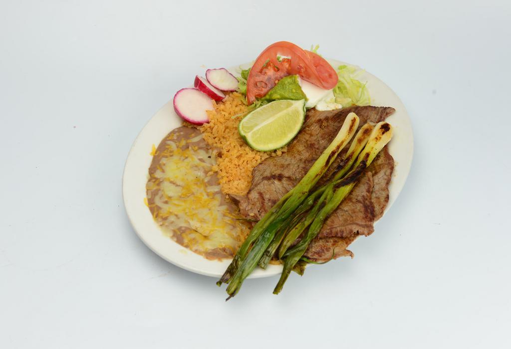 Steak Plate · Grilled steak with green onions, rice, beans, sour cream, guacamole, salad, and corn tortillas. 