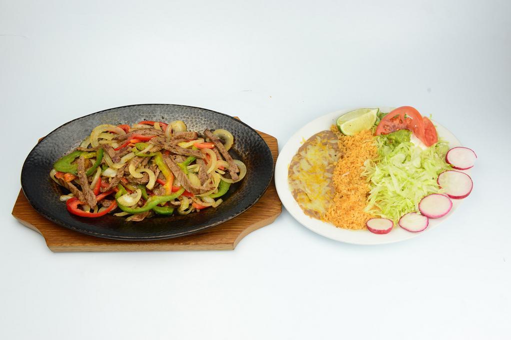 Fajitas Plate · Choice of grilled beef or chicken with grilled onions, peppers, rice, beans, guacamole, sour cream and salad. 