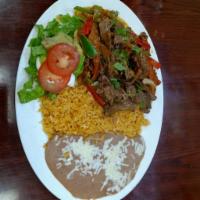 Bistec Ranchero · Mexican style grilled beef steak, beans, rice, sour cream, guacamole, salad and tortillas.
