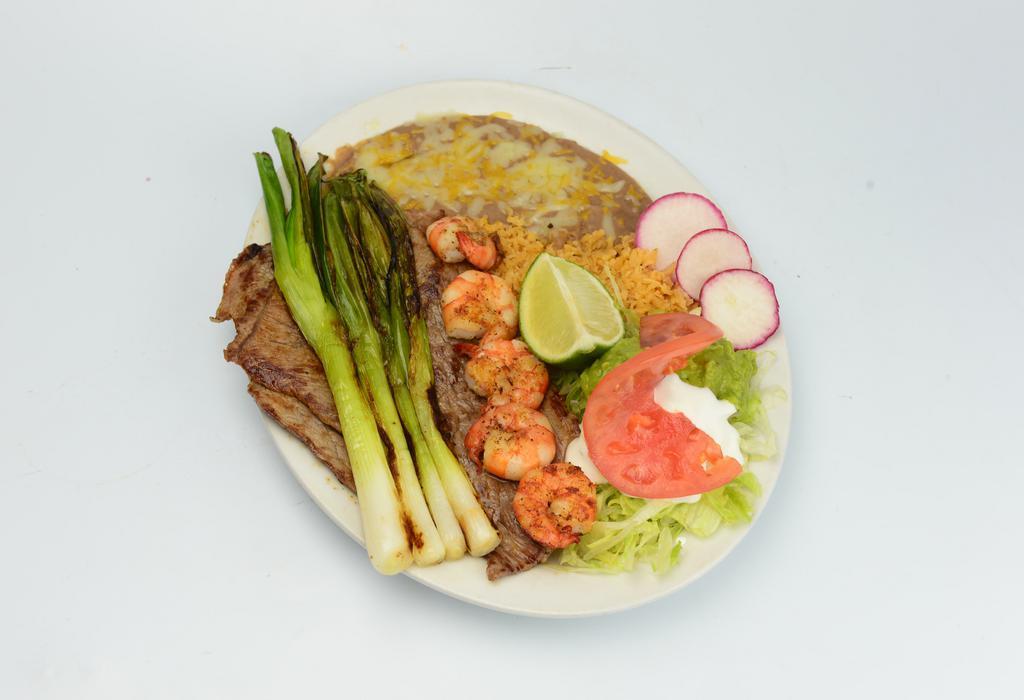 Steak and Prawn Plate · Steak, prawns, rice, beans, sour cream, guacamole, salad and tortillas. 