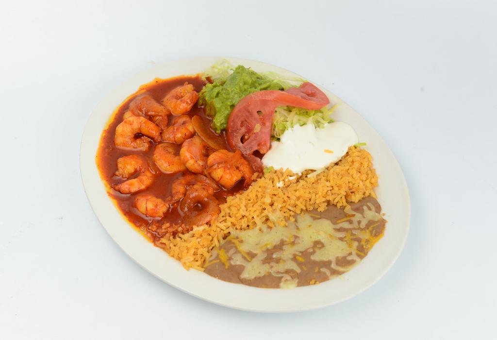 Camarones a la Diabla (Spicy Shrimp) · Prawns, rice, beans, guacamole, sour cream, salad and tortillas.

