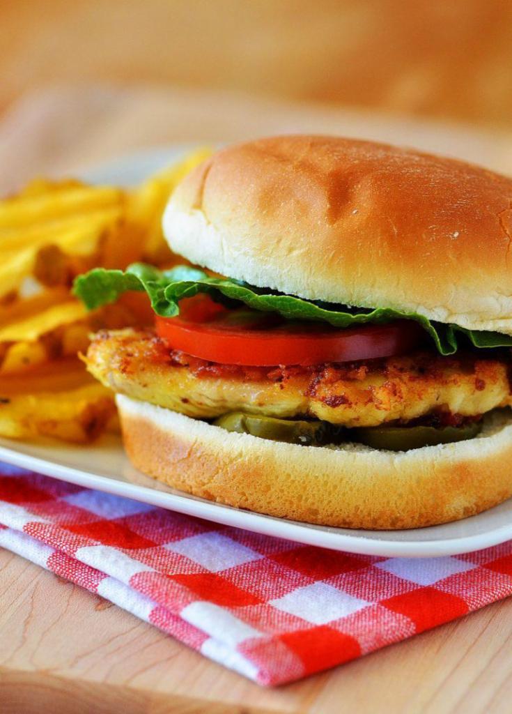 Chicken Breast · served with fries , tomato, onion ,lettuce 