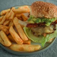 Avo Burger · With melted Jack cheese, avocado and bacon. Served with tomato, lettuce, onions, pickles and...