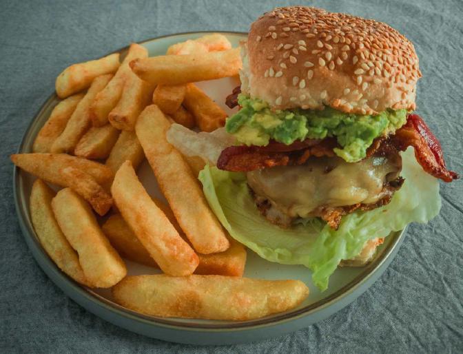 Avo Burger · With melted Jack cheese, avocado and bacon. Served with tomato, lettuce, onions, pickles and fries.