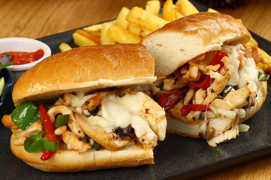 Chicken Philly Sandwich · Melted Jack cheese, grilled onions and bell peppers. Served with tomato, lettuce, onions, pickles and fries.