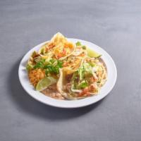 Soft Tacos · Filled with choice of meat topped with lettuce, pico de gallo and cheese served with Mexican...