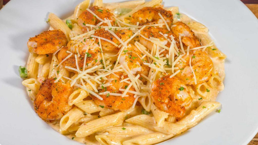 Cajun Shrimp Pasta · Penne pasta tossed in a Parmesan cream sauce with bell peppers, topped with Parmesan cheese.