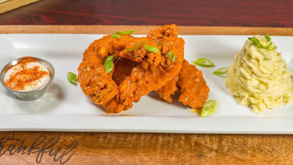 Chicken Tenders · Fried chicken tenders tossed in your choice of honey BBQ, sweet chili, Buffalo mild or Asian sesame glazed.