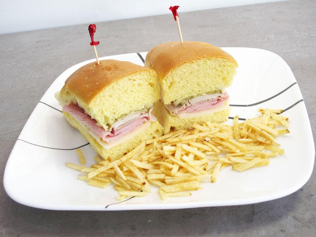 Media Noche Sandwich · Ham, Swiss cheese, mustard, mayonnaise, pickle and pork ham.