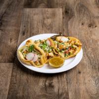 Pollo Taco · 3 tacos served with choice of meat, cilantro and grilled cebollines.