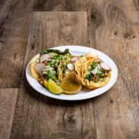 Carnitas Taco · 3 tacos served with choice of meat, cilantro and grilled cebollines.