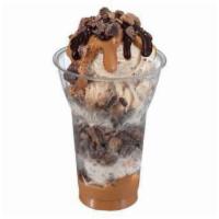 Reese Peanut Butter Cup Layered Sundae · 3 scoops of Reese's peanut butter cup ice cream topped with layers of Reese's peanut butter ...