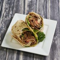 Gyro Wrap · Beef and lamb gyro, creamy hummus, romaine lettuce, roma tomatoes, and red onions with tzazi...