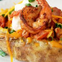 Seafood Baked Potato · Crisp potato with a soft center with the skin still on. filled with a lovely seafood mix top...