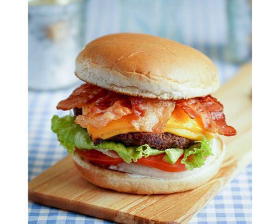 Bacon Cheeseburger · A 1/3lb. all beef patty served on toasted bun with tomatoes, lettuce. onions and dressing. Comes with two thick slices of melted cheese and three slices of bacon.