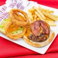 Munchie Burger · Served with 1/2 lb. fresh ground beef, bacon, cheddar, cheese, onion rings, horse radish sau...
