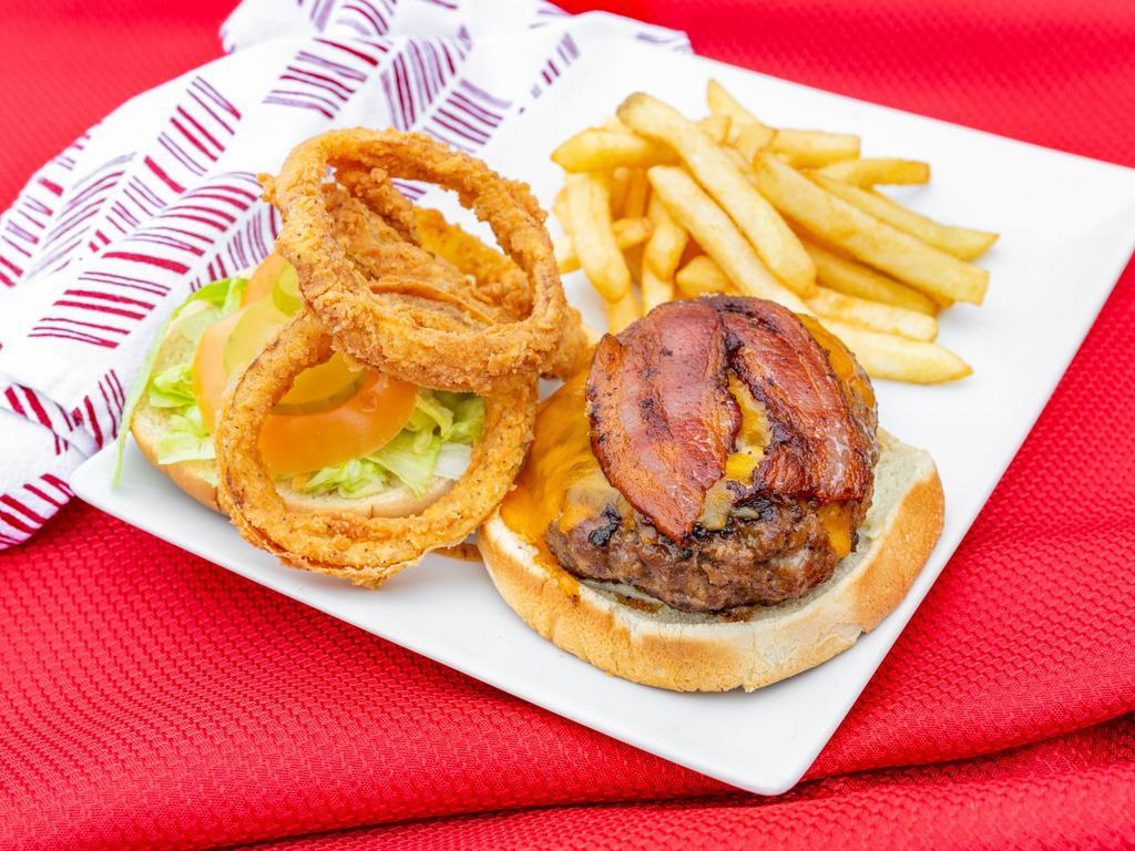 Munchie Burger · Served with 1/2 lb. fresh ground beef, bacon, cheddar, cheese, onion rings, horse radish sauce, lettuce, tomato, pickles, french fries and a drink.