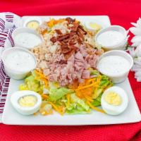 Chef Salad · Served with lettuce, tomato, ham, turkey, roast beef, egg, bacon, cheddar cheese and bread.