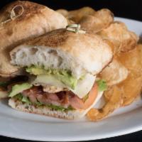 Chicken and Avocado Sandwich · Grilled chicken, avocado, bacon, arugula, whole grain honey mustard and Swiss cheese. Served...