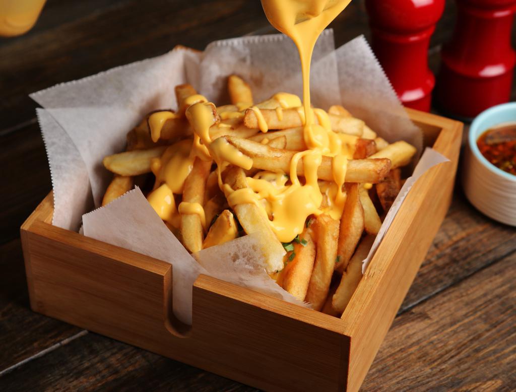 Cheese Fries · Crispy french fries drizzled with yummy cheese sauce