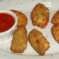 Jalapeno Poppers · 6 pieces. Stuffed with cheese and fried.