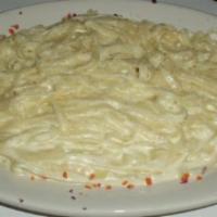 Fettuccine Alfredo · Rich butter and Parmesan sauce mixed in with fettuccine pasta.