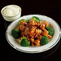 S2. Sesame Chicken · Chunks of chicken deep fried crispy in chef special sauce surrounded with broccoli.
