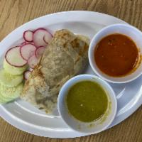 Burrito  · Wet or dry. 
Your choice of meat; asada, al pastor, tripa, lengua, cachete, or pollo 
(Beef,...