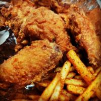 Chicken Wing · Cooked wings of chicken coated with sauce or seasoning.