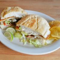Tortas · Choice of meat, lettuce, tomato, onion, avocado, jalapeno peppers and sour cream on a Mexica...