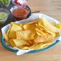 Chips and Salsa · Basket of homemade corn tortilla chips with mild salsa on the side.