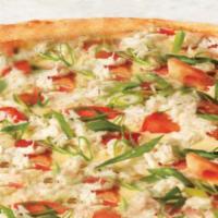 Maryland Style Crab Pizza · Handfuls of flavorful crabmeat and fresh tomatoes in our Old Bay spiced Alfredo sauce, toppe...