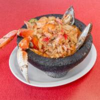 Molcajete del Mar  · Crab legs, mussels, shelled shrimp, octopus, scallop, crab and clam cooked in a spicy red sa...
