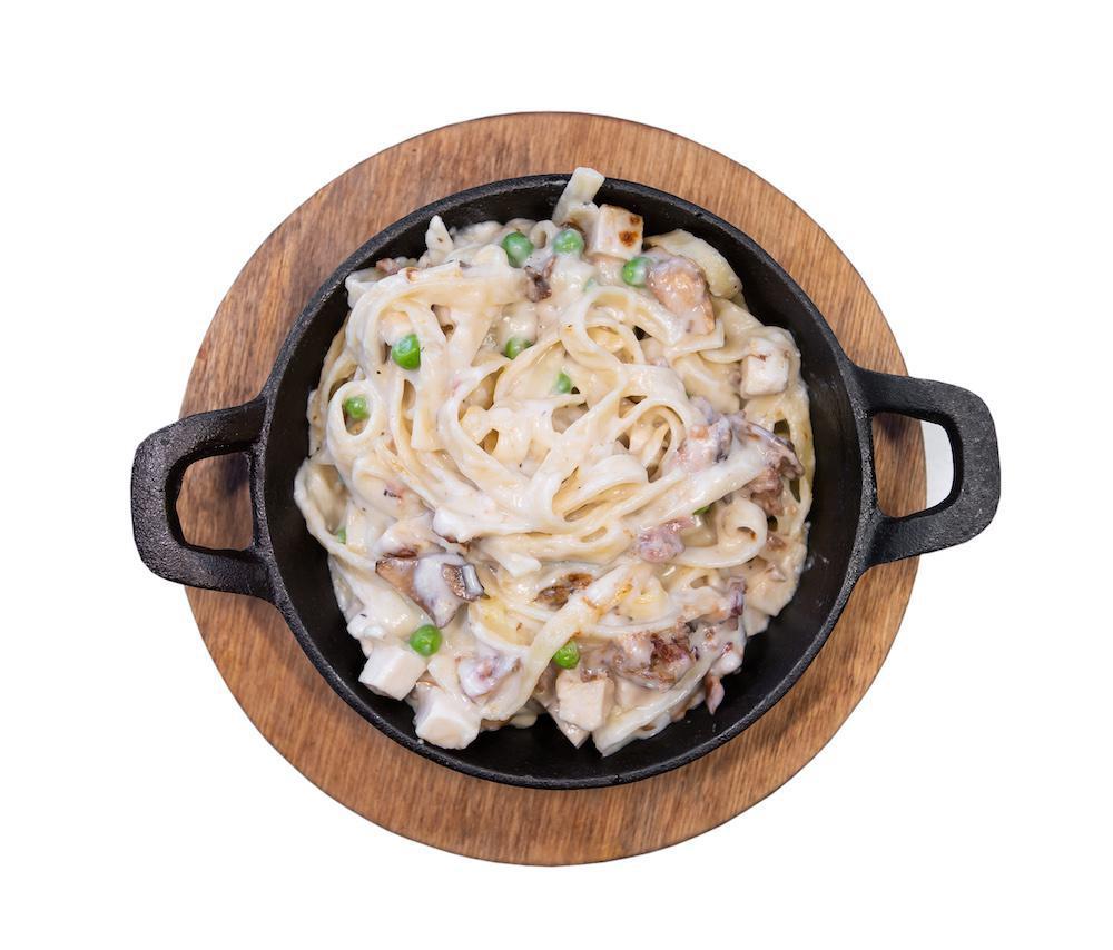 Country Alfredo Pasta · Fettuccine Noodles with Chicken, Bacon, and Mushrooms.

