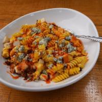 Buffalo Chicken Mac · Spiral macaroni with our house made cheese recipe mixed with Frank’s Buffalo sauce, oven roa...