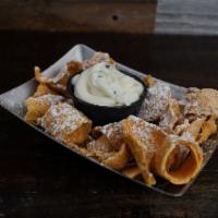 Cannoli Dip · Our Sweet creamy ricotta cheese and chocolate chips served with pieces of broken cannoli she...