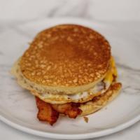 Pancake Sandwich · Fried egg, American cheese, with your choice of ham, turkey, sausage or bacon between two fl...