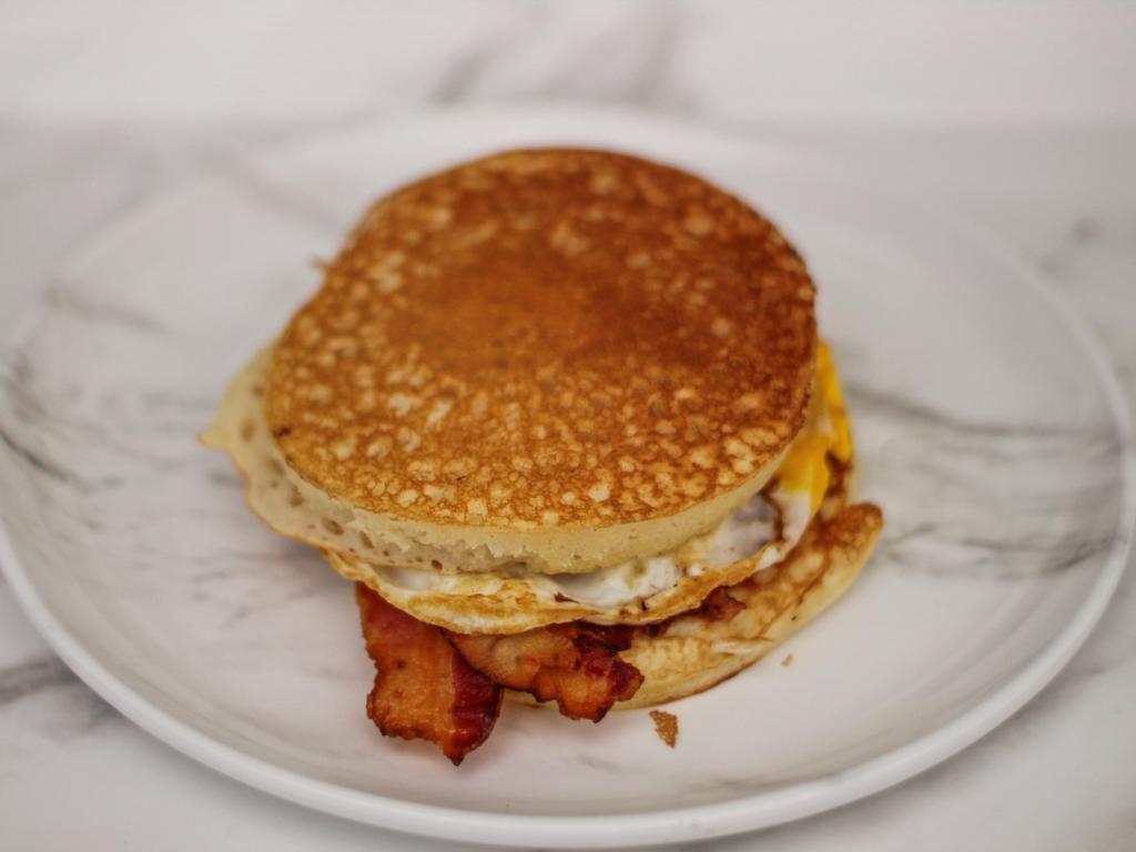 Pancake Sandwich · Fried egg, American cheese, with your choice of ham, turkey, sausage or bacon between two fluffy homemade pancakes.