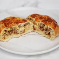 Texas Sausage Kolache · Genuine Texas sausage and cheddar cheese in a homemade bread pocket.