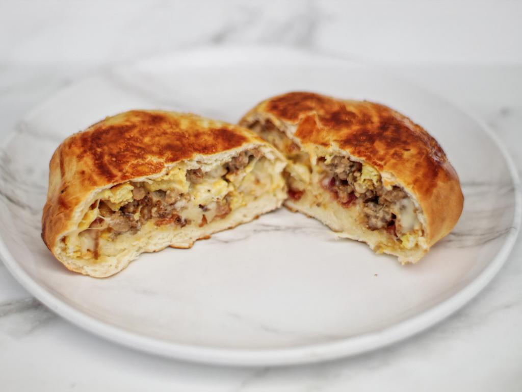 Texas Sausage Kolache · Genuine Texas sausage and cheddar cheese in a homemade bread pocket.