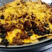Cheese Nachos Appetizer · Fresh tortilla chips, green pepper, black olive, diced tomato, onion, topped with cheddar an...