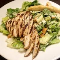 Grilled Chicken Caesar Salad · Fresh romaine lettuce, homemade croutons, Parmesan cheese, and a grilled chicken breast.