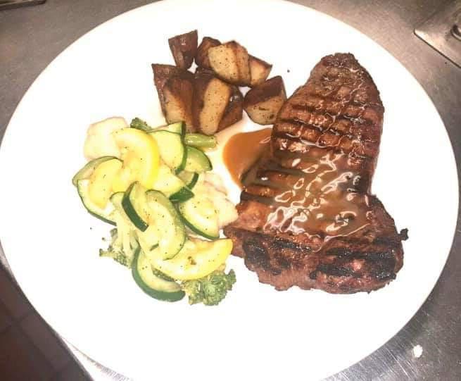 New York Strip · 12 oz. strip steak, cooked just the way you like it. Drizzled with our house-made zip saupplce. Served with vegetable medley, and your choice of potato.