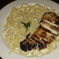 Fettuccine Alfredo · Homemade Alfredo sauce over a heaping portion of fettuccini noodles. Add chicken or shrimp f...