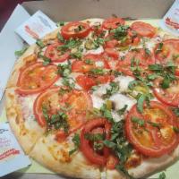 Margherita Pizza · Tomatoes, basil, garlic, mozzarella cheese, marinara sauce.