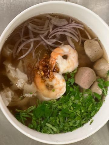 Pho · Sliced beef, beef tripe, meatballs, shrimp, rice noodles, onion, beef broth, bean sprouts, basil, jalapenos, lime, and cilantro.